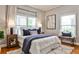 Comfortable bedroom with neutral decor, large windows, and a plush rug for a serene atmosphere at 32 Howell Se St, Atlanta, GA 30312