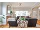 Cozy living room with a brick fireplace and hardwood floors at 32 Howell Se St, Atlanta, GA 30312