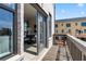 A view through an open sliding door showing a balcony and dining area at 525 Rubato Knl, Mcdonough, GA 30253