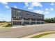 Modern townhome exteriors offer private garages and balconies at 525 Rubato Knl, Mcdonough, GA 30253