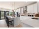 Bright kitchen with quartz countertops, modern stainless steel appliances, and an island with bar seating at 525 Rubato Knl, Mcdonough, GA 30253