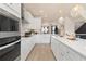 Well-equipped kitchen featuring modern appliances, white cabinets, and sleek countertops at 525 Rubato Knl, Mcdonough, GA 30253