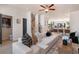 Bright living area showcasing a large sofa, stylish decor, and a staircase leading to upper floors at 525 Rubato Knl, Mcdonough, GA 30253