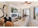 Cozy living room with an electric fireplace, plush white sofa, and stylish decor at 525 Rubato Knl, Mcdonough, GA 30253