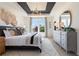 This main bedroom features large windows, a gray dresser, and contemporary decor at 525 Rubato Knl, Mcdonough, GA 30253