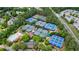 Aerial view of community tennis and pickleball courts with trees and parking at 1021 Wetherby Way, Alpharetta, GA 30022