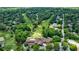 Aerial view of a clubhouse, pool, and golf course in a green residential area at 1021 Wetherby Way, Alpharetta, GA 30022