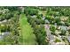 Aerial view of a lush green golf course community with beautiful homes at 1021 Wetherby Way, Alpharetta, GA 30022