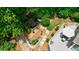 Private backyard features a wooden deck with patio furniture, plus a hot tub area surrounded by mature landscaping at 1021 Wetherby Way, Alpharetta, GA 30022