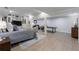 Open basement showcasing an entertainment area, an office area, and light hardwood flooring at 1021 Wetherby Way, Alpharetta, GA 30022