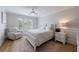 This bedroom features a plush recliner, a comfortable bed, and large window at 1021 Wetherby Way, Alpharetta, GA 30022