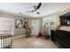 Bright Bedroom showcasing a modern ceiling fan, plantation shutters, and animal-themed decor at 1021 Wetherby Way, Alpharetta, GA 30022