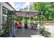 Outdoor deck featuring a shaded seating area with comfortable furniture and lovely greenery at 1021 Wetherby Way, Alpharetta, GA 30022