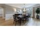 Formal dining room with chandelier, large windows, and elegant wall trim at 1021 Wetherby Way, Alpharetta, GA 30022