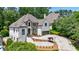 Beautiful two-story home with a well-maintained front yard and elegant architectural details at 1021 Wetherby Way, Alpharetta, GA 30022
