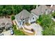 Beautiful home showcasing well-maintained landscaping, a charming facade, and a spacious driveway at 1021 Wetherby Way, Alpharetta, GA 30022