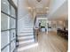 Bright foyer with hardwood floors, a grand staircase, and soaring ceilings at 1021 Wetherby Way, Alpharetta, GA 30022