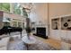Bright living room with high ceilings, large windows, fireplace, and hardwood floors at 1021 Wetherby Way, Alpharetta, GA 30022