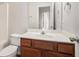 Bathroom featuring a vanity with brown cabinets, a mirror, sink and a toilet at 1954 Durwood Ln, Duluth, GA 30096