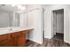 Bathroom featuring a vanity, mirror, lights and a shower with a glass door at 1954 Durwood Ln, Duluth, GA 30096