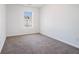 Bedroom featuring carpet floors and natural light from the large window at 1954 Durwood Ln, Duluth, GA 30096