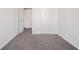 Bedroom featuring carpet floors, two doors and white baseboards at 1954 Durwood Ln, Duluth, GA 30096