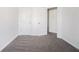 Bedroom featuring carpet floors, an open closet and two doors at 1954 Durwood Ln, Duluth, GA 30096
