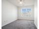 Bedroom featuring carpet floors, a ceiling fan and natural light from the large window at 1954 Durwood Ln, Duluth, GA 30096