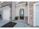 A close-up of the front door showing the entryway with stone and siding details at 1954 Durwood Ln, Duluth, GA 30096