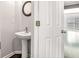 Stylish half bathroom featuring a pedestal sink and modern finishes at 1954 Durwood Ln, Duluth, GA 30096