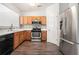 Modern kitchen featuring stainless steel appliances, and tile backsplash at 1954 Durwood Ln, Duluth, GA 30096