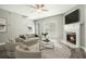 Cozy living room with fireplace, neutral colors, and plenty of natural light at 1954 Durwood Ln, Duluth, GA 30096