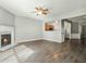 Living room with fireplace, light grey walls, and views of the kitchen at 1954 Durwood Ln, Duluth, GA 30096