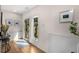 Inviting entryway with hardwood floors, white trim and paneling, and a glass door bringing the outside in at 219 Howell Se Dr # A, Atlanta, GA 30316