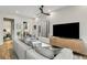Bright living room with hardwood floors, TV, and an open doorway to the bedroom at 219 Howell Se Dr # A, Atlanta, GA 30316