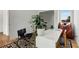 Stylish office with a white desk, black chair, and decorative plant, creating a functional workspace at 219 Howell Se Dr # A, Atlanta, GA 30316