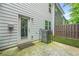 The home's backyard featuring the patio and A/C unit at 3181 Meadowstone Sw Ln, Atlanta, GA 30331