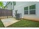 The home's backyard featuring the patio and A/C unit at 3181 Meadowstone Sw Ln, Atlanta, GA 30331