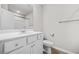 A full bathroom with wood look tile, white vanity and a shower and tub at 3181 Meadowstone Sw Ln, Atlanta, GA 30331