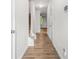 Bright hallway with wood-look floors, white walls and trim, leading to the main living areas at 3181 Meadowstone Sw Ln, Atlanta, GA 30331