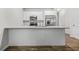 Modern kitchen featuring stainless steel appliances, white cabinets, granite countertops, and hardwood floors at 3181 Meadowstone Sw Ln, Atlanta, GA 30331