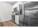 Close up of modern kitchen with stainless steel appliances and white cabinets at 3181 Meadowstone Sw Ln, Atlanta, GA 30331