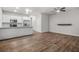 Open-concept layout featuring a kitchen, dining area, and living room with hardwood floors at 3181 Meadowstone Sw Ln, Atlanta, GA 30331