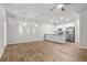 Open-concept layout featuring a kitchen, dining area, and living room with hardwood floors at 3181 Meadowstone Sw Ln, Atlanta, GA 30331