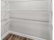 Spacious walk-in closet equipped with shelving for optimal storage and organization at 3181 Meadowstone Sw Ln, Atlanta, GA 30331