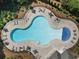Aerial view of the community pool, showcasing the lounge chairs and umbrellas around the fenced pool area at 3255 Morgan Rd, Buford, GA 30519