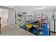 Open basement offers a large table area, perfect for entertaining and crafting, with carpet flooring at 3255 Morgan Rd, Buford, GA 30519