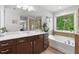 Bathroom features double sinks, a soaking tub and a glass enclosed shower at 3255 Morgan Rd, Buford, GA 30519