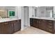 Bathroom with separate dark wood vanities and mirrors at 3255 Morgan Rd, Buford, GA 30519