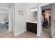 Bathroom with vanity and lighting fixtures that opens to walk-in closet and bedroom at 3255 Morgan Rd, Buford, GA 30519
